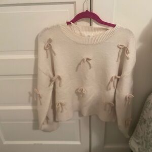 Chic Cream Sweater with Bow Details